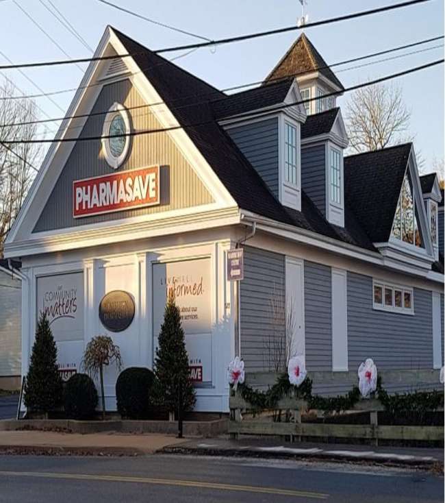 Grey building exterior with Pharmasave signage