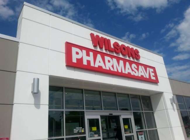 White building with Wilson's Pharmasave signage out front